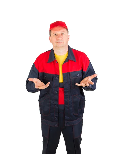 Trabajador en ropa de trabajo y gorra roja . — Foto de Stock