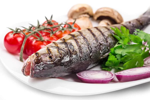 Grilled seabass on plate with tomatoes. — Stock Photo, Image