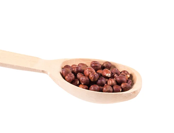 Wooden spoon with nuts. — Stock Photo, Image