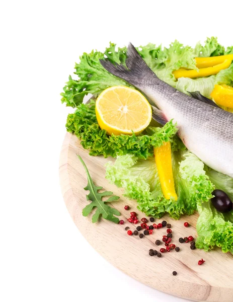 Composition of fresh seabass and vegetables — Stock Photo, Image