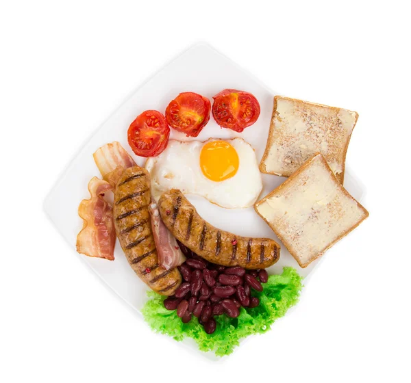 Fried egg with sausage on plate. — Stock Photo, Image