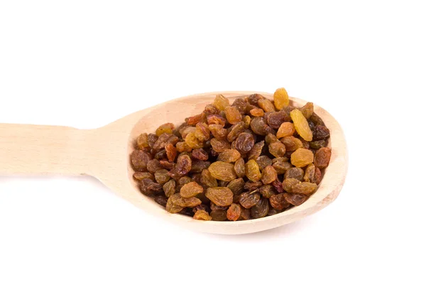 Wooden spoon with raisins. — Stockfoto