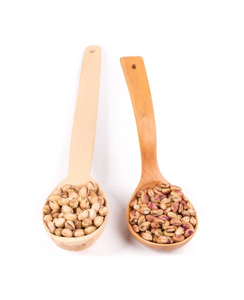 Collage of spoons with pistachios. — Stock Photo, Image