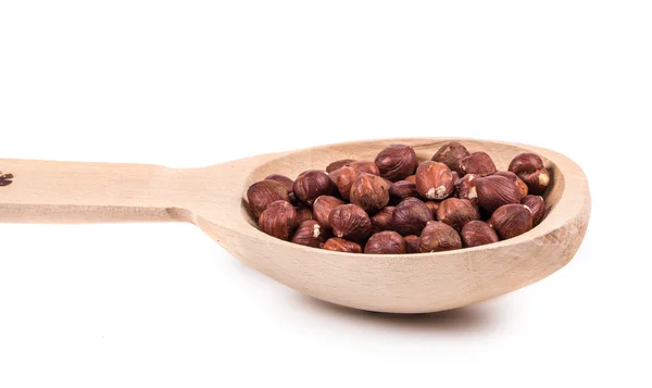Houten lepel met noten. — Stockfoto