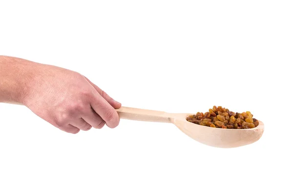 Wooden spoon with raisins. — Stockfoto