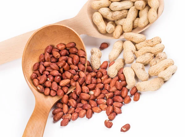 Wooden spoons with peanuts. — Stock Photo, Image