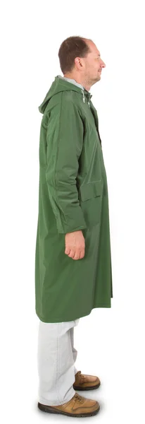 Man in rain green  coat. — Stok Foto