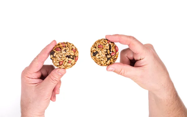 Biscoitos com sementes nas mãos — Fotografia de Stock