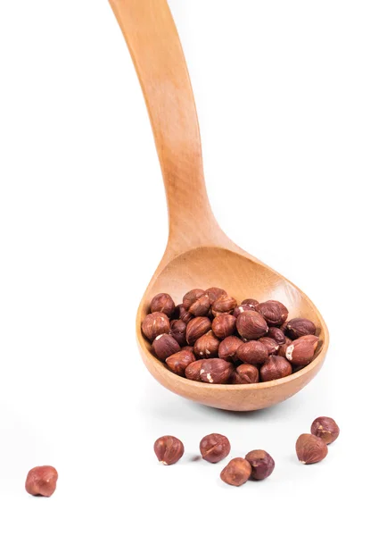 Wooden spoon with nuts. — Stock Photo, Image