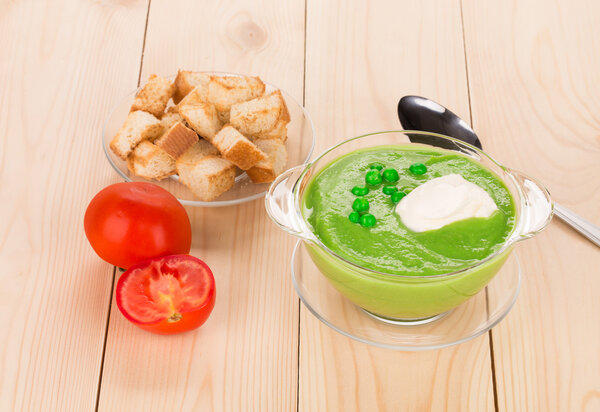 Broccoli cream soup on table.