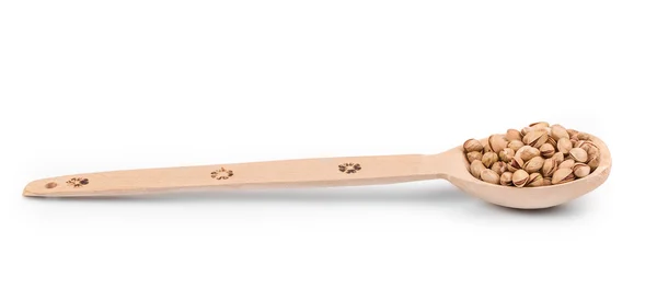 Wooden spoon with pistachios. — Stock Photo, Image