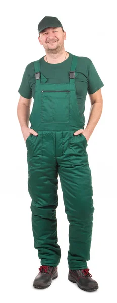 Werknemer in groene overalls. — Stockfoto