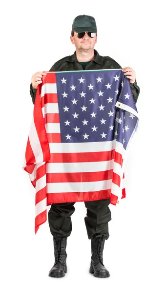 Hombre en puestos de ropa de trabajo con bandera americana . — Foto de Stock