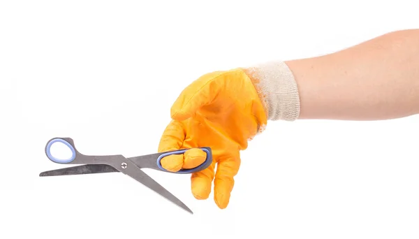 Hand in glove holding scissors. — Stock Photo, Image