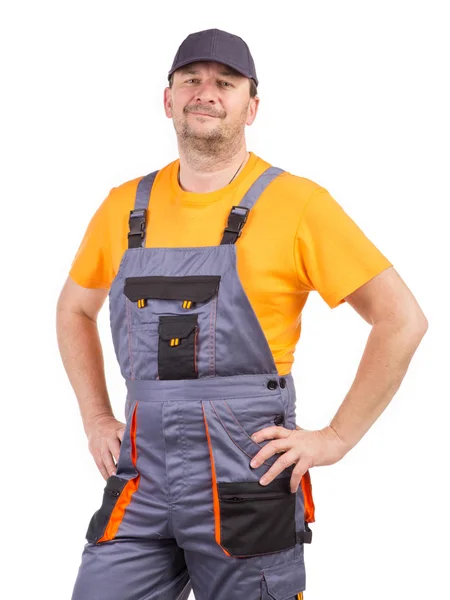 Worker in overalls on a white — Stock Photo, Image
