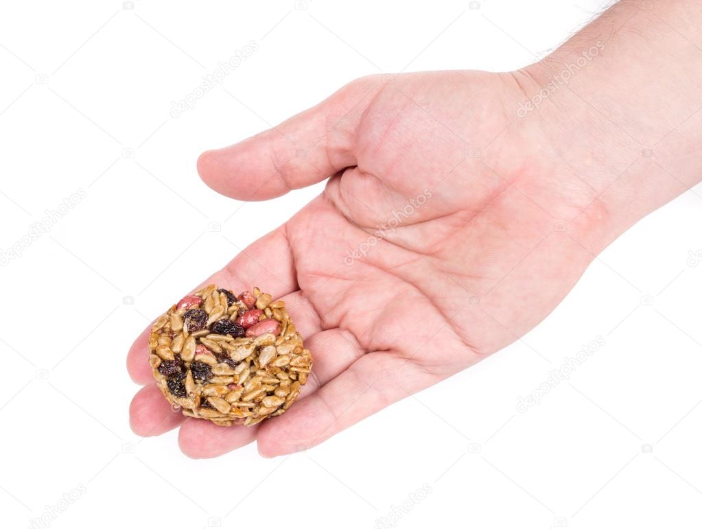 Candied roasted sunflower seeds in hand.
