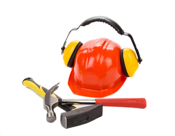 Ear muffs on hard hat and hammers. — Stock Photo, Image