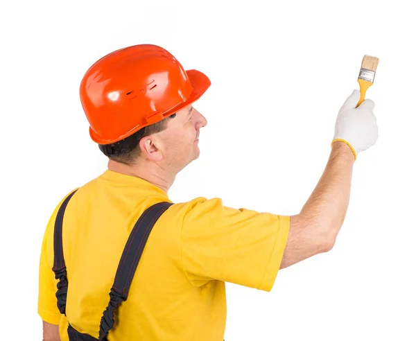 Worker in hardhat with paint brush. — Stock Photo, Image