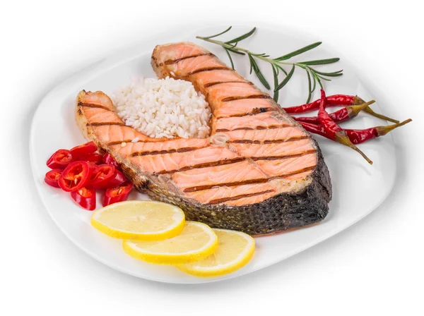 Grilled salmon steak with vegetables on plate. — Stock Photo, Image