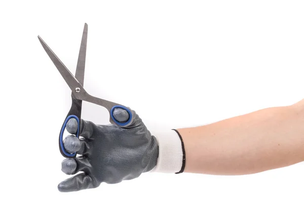 Hand in glove holding scissors. — Stock Photo, Image