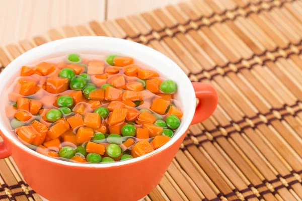 Peas and carrots in plate. — Stock Photo, Image