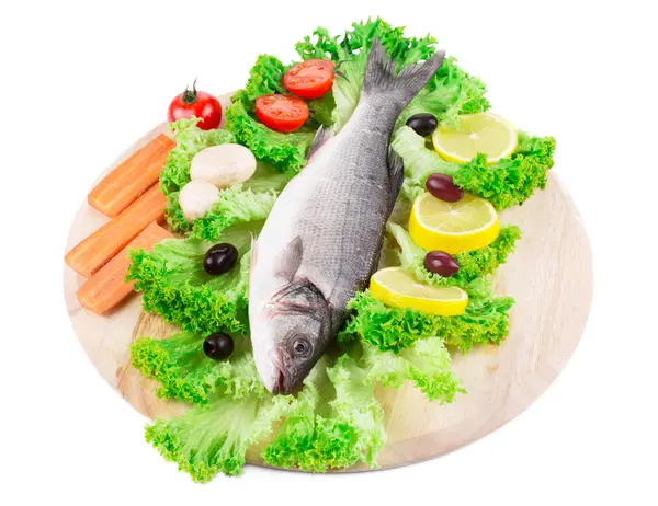 Composition of fresh seabass with carrot — Stock Photo, Image