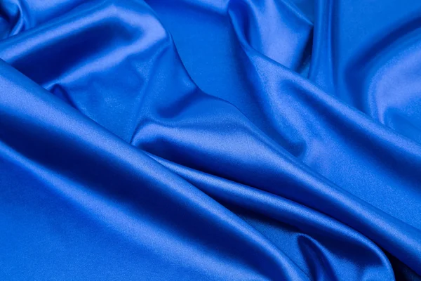 Draperie en soie bleue en gros plan . — Photo