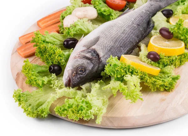 Composition of fresh seabass with carrot. — Stock Photo, Image