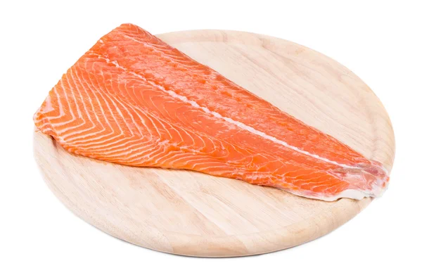 Raw salmon fillet on wood platter. — Stock Photo, Image