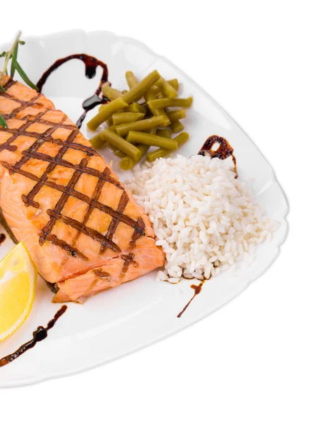 Salmon fillet with rice and peas — Stock Photo, Image