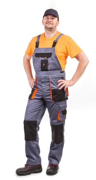 Gelukkig werknemer dragen van Amerikaanse overalls. — Stockfoto