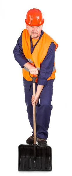 Worker holding black shovel. — Stock Photo, Image