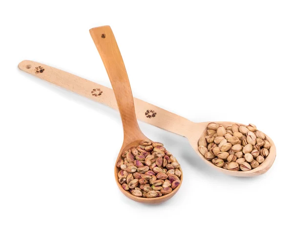 Two wooden spoons with pistachios. — Stock Photo, Image