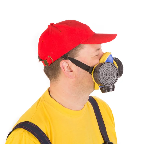 Worker in hat with respirator. — Stock Photo, Image
