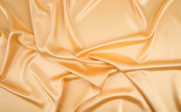 Golden silk cloth texture. — Stock Photo, Image