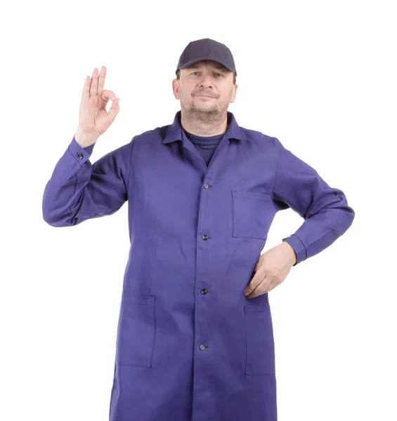 Pracownik w niebieski nosić znak ok. — Zdjęcie stockowe