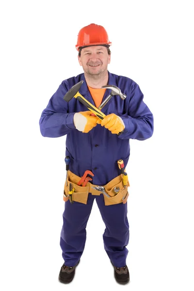 Trabajador en sombrero duro sosteniendo martillos . —  Fotos de Stock