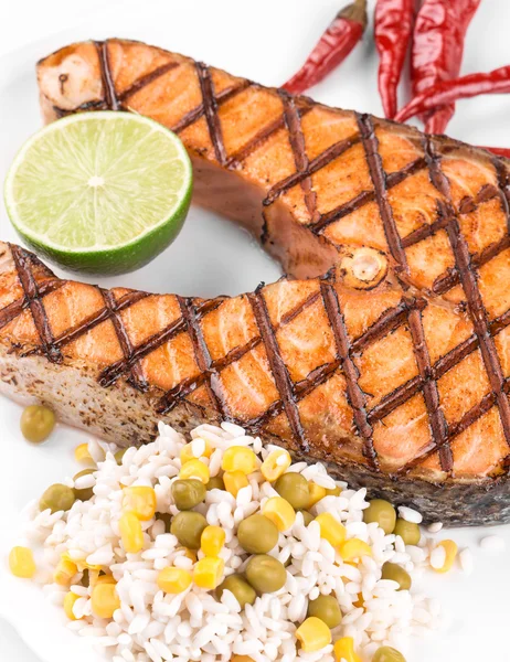 Salmon steak on white plate close-up — Stock Photo, Image