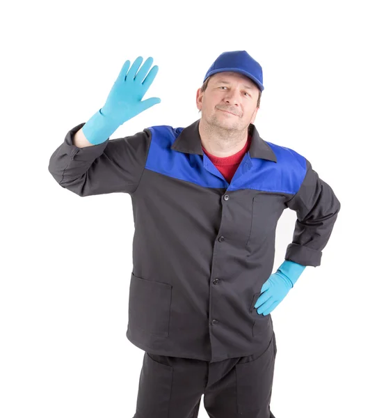 Man in blue gloves with raised hand. — Stock Photo, Image