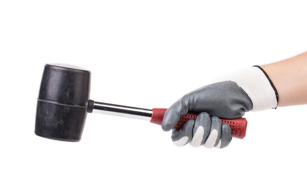 Man's hand in glove holds hammer. — Stock Photo, Image