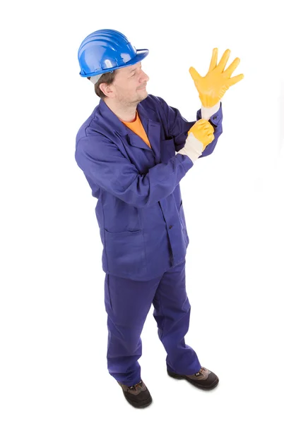 Trabajador en traje de trabajo azul y guantes amarillos . —  Fotos de Stock