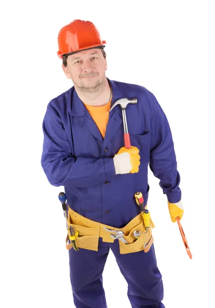 Trabalhador em protetor capacete segurando martelo . — Fotografia de Stock