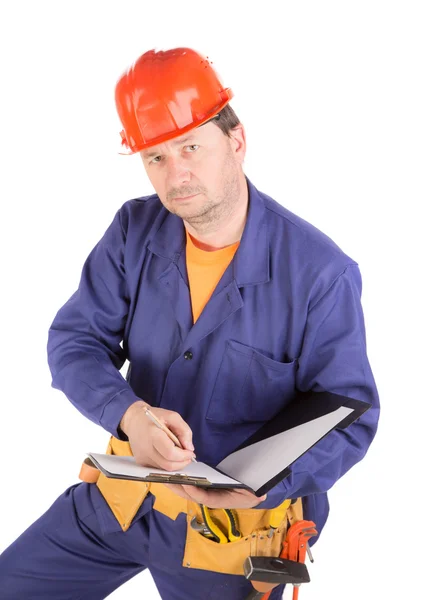 Travailleur en casque dur avec stylo . — Photo