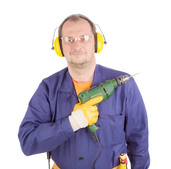 Trabalhador em auriculares segurando broca . — Fotografia de Stock