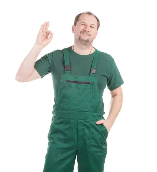 Werknemer in groene overalls. — Stockfoto