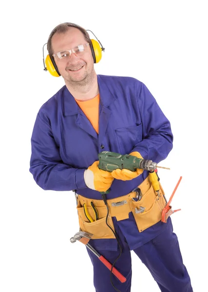 Hombre en traje de trabajo sosteniendo taladro — Foto de Stock