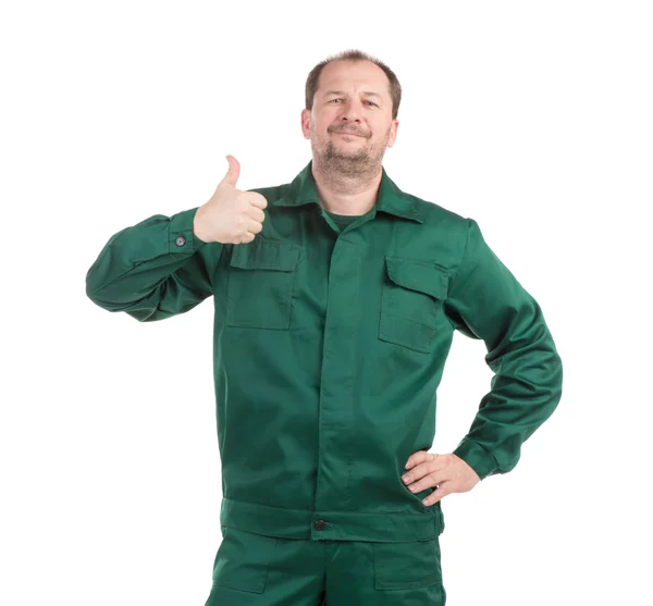 Arbeiter in grünem Overall zeigt großes Zeichen — Stockfoto