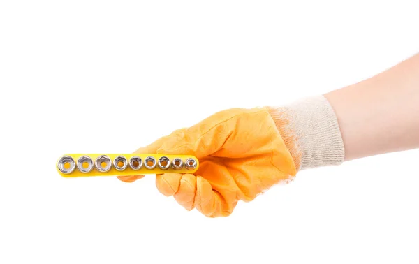 Hand in glove holding nozzles for screwdriver. — Stock Photo, Image