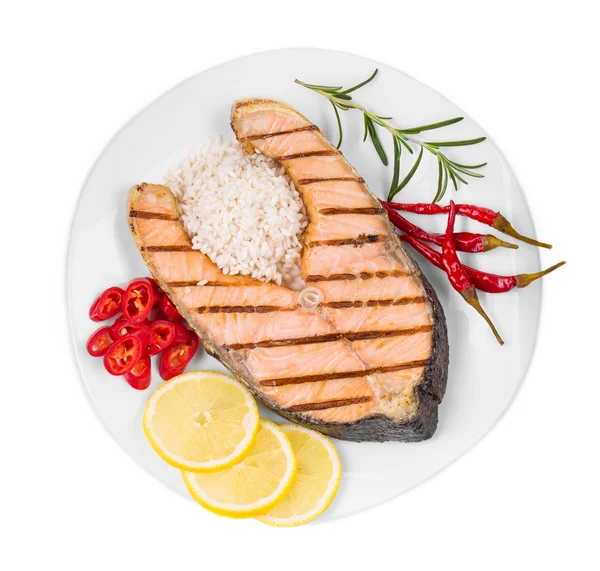 Salmon fillet with lemon, rice and pepper — Stock Photo, Image