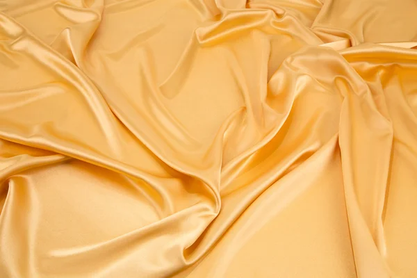 Złoty jedwabnych draperii. — Zdjęcie stockowe